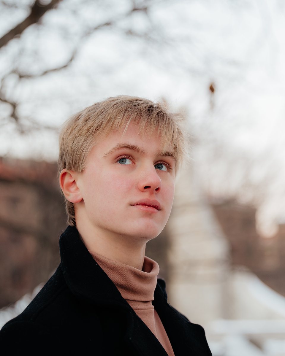 Portrait of Joel Haley outdoors in winter, looking up